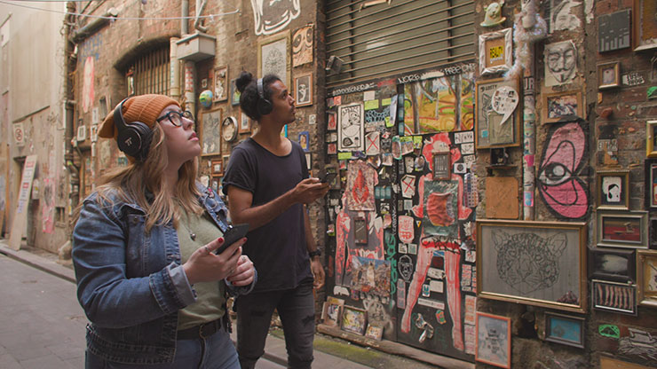 Two people walking down Melbourne laneway